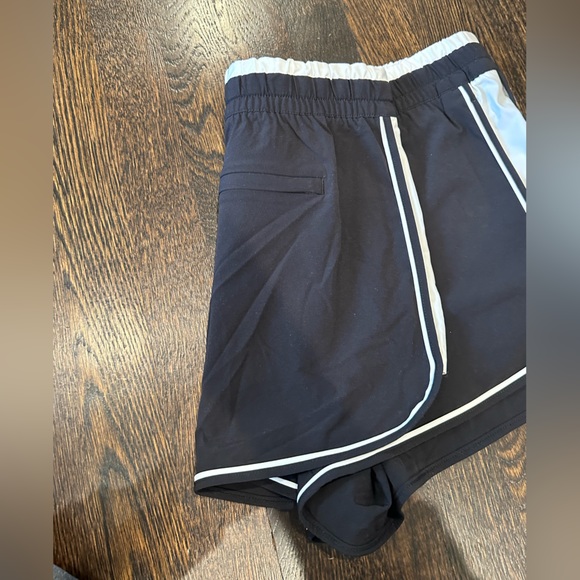 Black Athleta shorts with white stripes and elastic waist - Picture 2 of 3